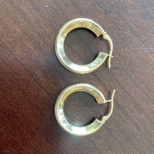 14k yellow gold hoop earrings.